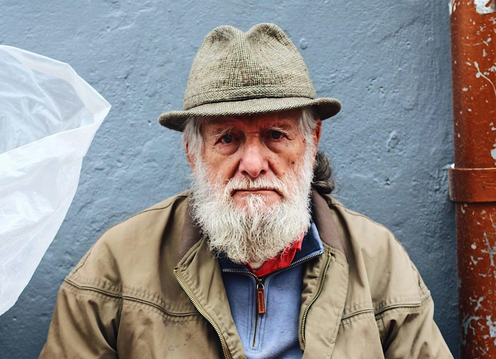 bearded man with decor on his lap
